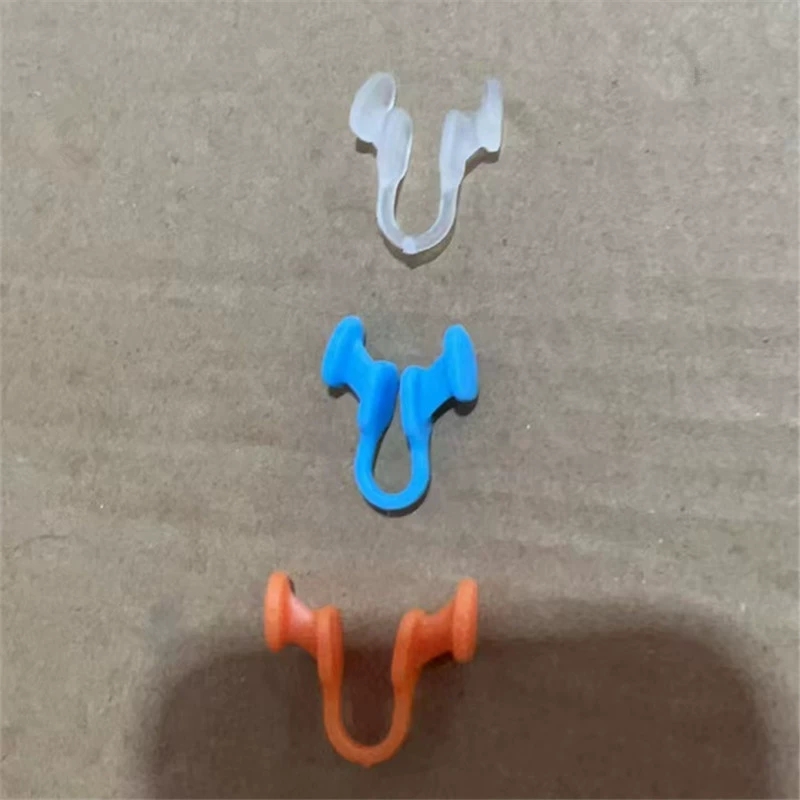 New mini anti-snoring health sleep aid device helps expand the nasal passages and has a soft silicone anti-snoring nose clip.